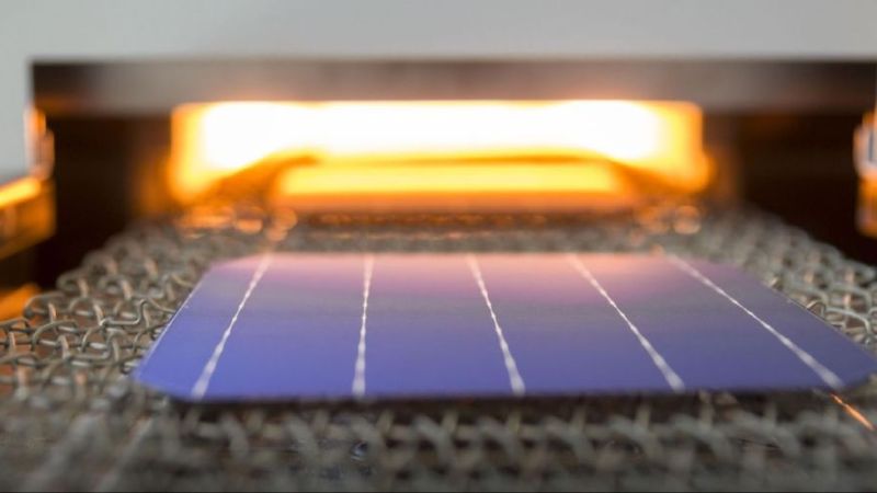 Furnace entrance with entering industrial solar wafer.