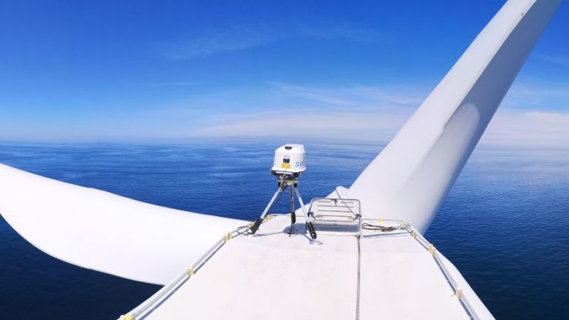 The photo shows the measuring system installed on the nacelle of a wind turbine.
