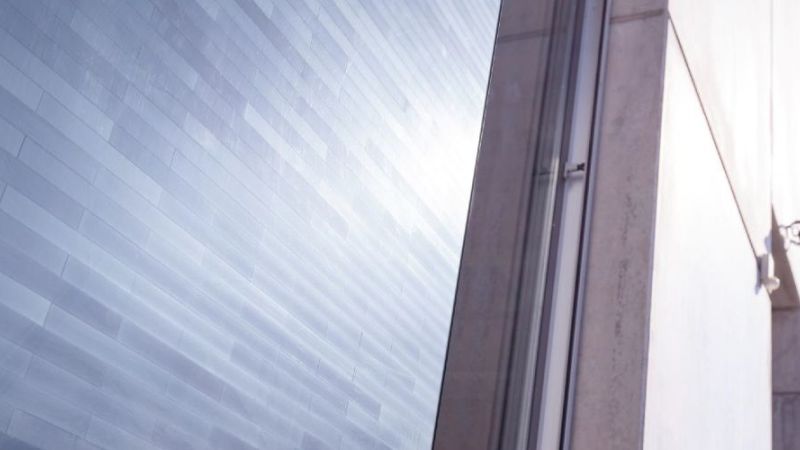 Matrix shingle modules on a building facade.