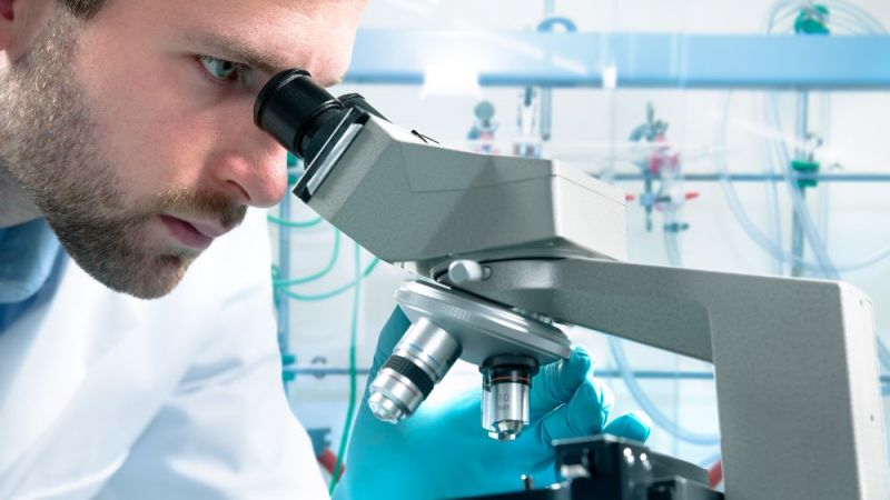 Man with microscope