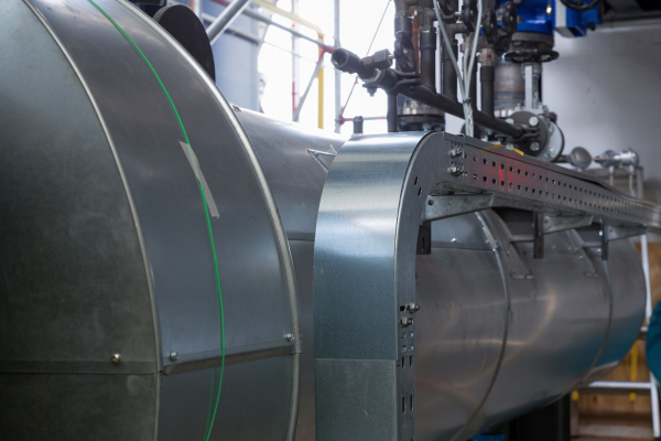 Illuminated thermal storage and cogeneration plant hall of BTB, Adlershof.