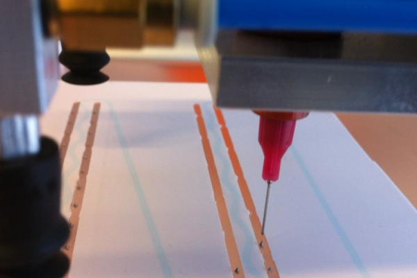 Application of conductive adhesive on ZEBRA IBC solar cells for module production with conductive rear side film.