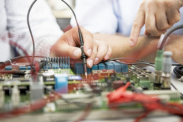 Electronics development – a newly constructed circuit is tested in the laboratory.
