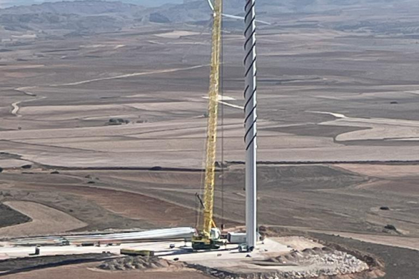 Tower of a wind turbine under construction with Scruton helix.